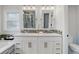 Bright bathroom features a double sink vanity with great lighting and access to an enclosed shower at 7831 W 109Th Ave, Westminster, CO 80021