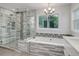 Contemporary bathroom boasting a shower, soaking tub, and a window overlooking the backyard at 7831 W 109Th Ave, Westminster, CO 80021