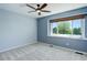 Comfortable bedroom featuring plush carpeting, natural light, and a neutral color scheme at 7831 W 109Th Ave, Westminster, CO 80021