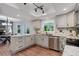 Well-lit kitchen with white cabinets, granite countertops, and stainless steel appliances at 7831 W 109Th Ave, Westminster, CO 80021