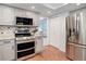 Stainless steel appliances, including a refrigerator and oven, in a well-appointed kitchen at 7831 W 109Th Ave, Westminster, CO 80021