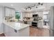 Well-lit kitchen featuring granite countertops, stainless steel appliances, and hardwood floors at 7831 W 109Th Ave, Westminster, CO 80021