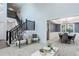 Spacious living room with a staircase and an open view to the dining area, offering a seamless flow at 7831 W 109Th Ave, Westminster, CO 80021