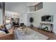 Open floor plan with living room, dining area, and kitchen featuring hardwood floors at 7831 W 109Th Ave, Westminster, CO 80021