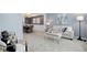 Inviting living room featuring neutral colors, plush carpet, and a view into the adjacent dining area at 7831 W 109Th Ave, Westminster, CO 80021