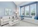 Bright living room featuring blue walls, a window seat, and lots of natural light at 7831 W 109Th Ave, Westminster, CO 80021
