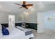 Main bedroom with a ceiling fan, carpet, and an attached bathroom, perfect for relaxation at 7831 W 109Th Ave, Westminster, CO 80021
