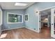 Bright sitting room featuring hardwood floors, many windows, natural light, and modern lighting at 7831 W 109Th Ave, Westminster, CO 80021