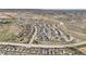 Aerial view of a large neighborhood with many similar modern homes and winding streets at 12580 Boggs St, Parker, CO 80134