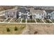 Aerial view of the neighborhood featuring modern homes, landscaping, and street at 12580 Boggs St, Parker, CO 80134