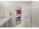 Stylish bathroom featuring a shower and granite countertops. Bedroom is through doorway at 12580 Boggs St, Parker, CO 80134