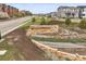 Community entrance sign amidst well-kept landscaping and green spaces at 12580 Boggs St, Parker, CO 80134