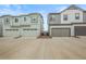 Exterior view of two modern homes with attached garages and well-maintained yards at 12580 Boggs St, Parker, CO 80134