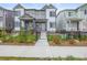 Charming townhome featuring a welcoming entrance and well-maintained landscaping at 12580 Boggs St, Parker, CO 80134