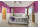 Comfortable main bedroom with view to en-suite bathroom and ample natural light at 12580 Boggs St, Parker, CO 80134