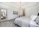 Serene bedroom with a comfortable bed, soft lighting, and access to an outdoor patio at 7410 Winter Berry Ln, Castle Pines, CO 80108