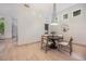 Dining area features a round table, modern chairs, and contemporary lighting at 7410 Winter Berry Ln, Castle Pines, CO 80108