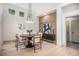 Well-lit dining area featuring modern decor, a round table, and a contemporary chandelier at 7410 Winter Berry Ln, Castle Pines, CO 80108