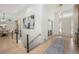 Open floor plan featuring sleek hardwood floors, modern lighting, and stylish decor at 7410 Winter Berry Ln, Castle Pines, CO 80108