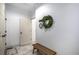 Entryway with bench, coat hooks, and an arched wreath decoration at 7410 Winter Berry Ln, Castle Pines, CO 80108
