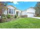 Charming home featuring a well-manicured lawn, stone accents, and a bright exterior at 7410 Winter Berry Ln, Castle Pines, CO 80108