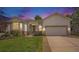 Charming single-Gathering home featuring a two-car garage and well-manicured lawn at 7410 Winter Berry Ln, Castle Pines, CO 80108