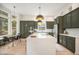 Stunning kitchen featuring a large island, modern appliances, and sleek cabinetry at 7410 Winter Berry Ln, Castle Pines, CO 80108