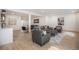 Spacious living room featuring stylish seating arrangements and bright lighting at 7410 Winter Berry Ln, Castle Pines, CO 80108