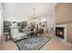 Bright open-concept living area with modern furnishings and an adjacent kitchen at 7410 Winter Berry Ln, Castle Pines, CO 80108