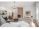 Inviting living room with cozy fireplace, modern decor, and bright natural light at 7410 Winter Berry Ln, Castle Pines, CO 80108