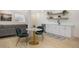 Convenient bar area with marble-look table, green chairs, and a drink refrigerator at 7410 Winter Berry Ln, Castle Pines, CO 80108