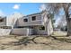 Exterior view of a home with neutral siding and a well-maintained yard at 90 S Fraser Cir, Aurora, CO 80012