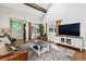 Living room featuring hardwood floors, comfortable seating, and bright, natural light at 90 S Fraser Cir, Aurora, CO 80012