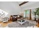 Bright living room featuring hardwood floors, comfortable seating, and ample natural light at 90 S Fraser Cir, Aurora, CO 80012