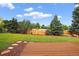 Large, private backyard with wooden fence and lovely landscaping, perfect for entertaining or relaxing outdoors at 5337 S Ukraine Way, Aurora, CO 80015
