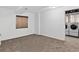 Basement interior with a window and modern laundry equipment, providing practical space at 5337 S Ukraine Way, Aurora, CO 80015