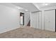 Open basement design, with carpeting, closet, and stairs to the upper level at 5337 S Ukraine Way, Aurora, CO 80015