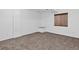 Clean basement room with neutral carpeting and a window allowing natural light at 5337 S Ukraine Way, Aurora, CO 80015