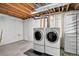 Basement with a modern washer and dryer set, ready for laundry tasks at 5337 S Ukraine Way, Aurora, CO 80015
