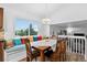 Dining area with a breakfast nook and a view looking into other rooms in the house at 5337 S Ukraine Way, Aurora, CO 80015