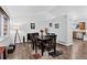 Open dining room with ample seating and natural light, perfect for gatherings and entertaining at 5337 S Ukraine Way, Aurora, CO 80015