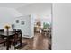 Open-concept dining area leads to a bright kitchen with modern appliances and a casual eating nook at 5337 S Ukraine Way, Aurora, CO 80015