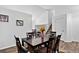 Spacious dining area with a large table, ideal for hosting dinner parties and Gathering meals at 5337 S Ukraine Way, Aurora, CO 80015