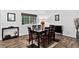 Cozy dining area with wood floors and a window view, perfect for Gathering dinners and entertaining at 5337 S Ukraine Way, Aurora, CO 80015