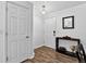 Welcoming entryway with wood flooring and a console table, offering a stylish first impression at 5337 S Ukraine Way, Aurora, CO 80015