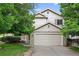 Charming two-story home with a two-car garage, well-maintained landscaping, and inviting curb appeal at 5337 S Ukraine Way, Aurora, CO 80015