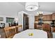 Bright eat-in kitchen features wood floors, stainless steel appliances, and a cozy dining area at 5337 S Ukraine Way, Aurora, CO 80015