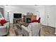 Inviting living room features a fireplace, comfortable seating, and natural light at 5337 S Ukraine Way, Aurora, CO 80015