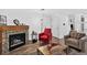 Cozy living room features a fireplace and comfortable seating, perfect for relaxing at 5337 S Ukraine Way, Aurora, CO 80015