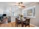 Cozy dining area with a view to the living room and a bright window at 3257 S Geneva St, Denver, CO 80231
